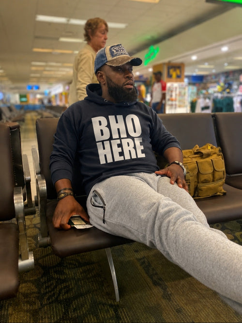 A man wearing Bho Here Hoodie – Zimbabwean Heritage Streetwear – Sister Style African Diaspora