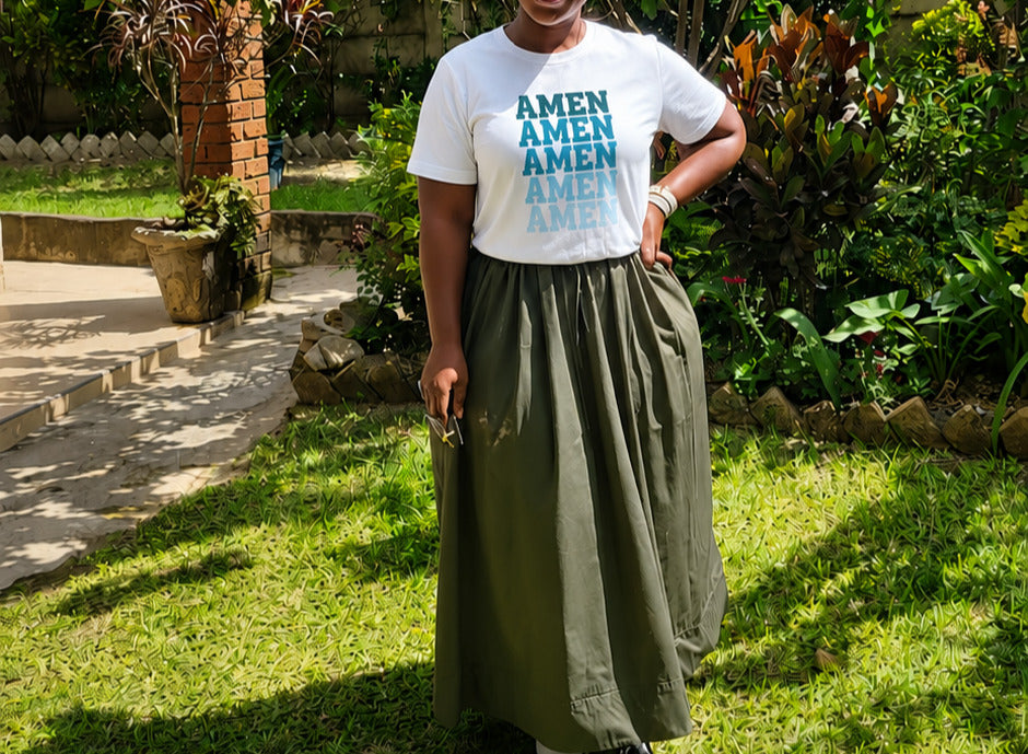 Woman wearing the Amen Tee by Sister Style in a garden — Christian faith streetwear African heritage Zimbabwe