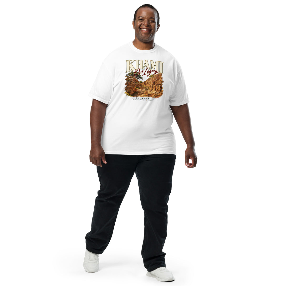 Model wearing a white Sister Style Khami t-shirt with stone ruins artwork and “Our Legacy” lettering, front view.