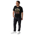 Man wearing a black He Heals the Brokenhearted organic cotton t-shirt with heart artwork, full-length view.