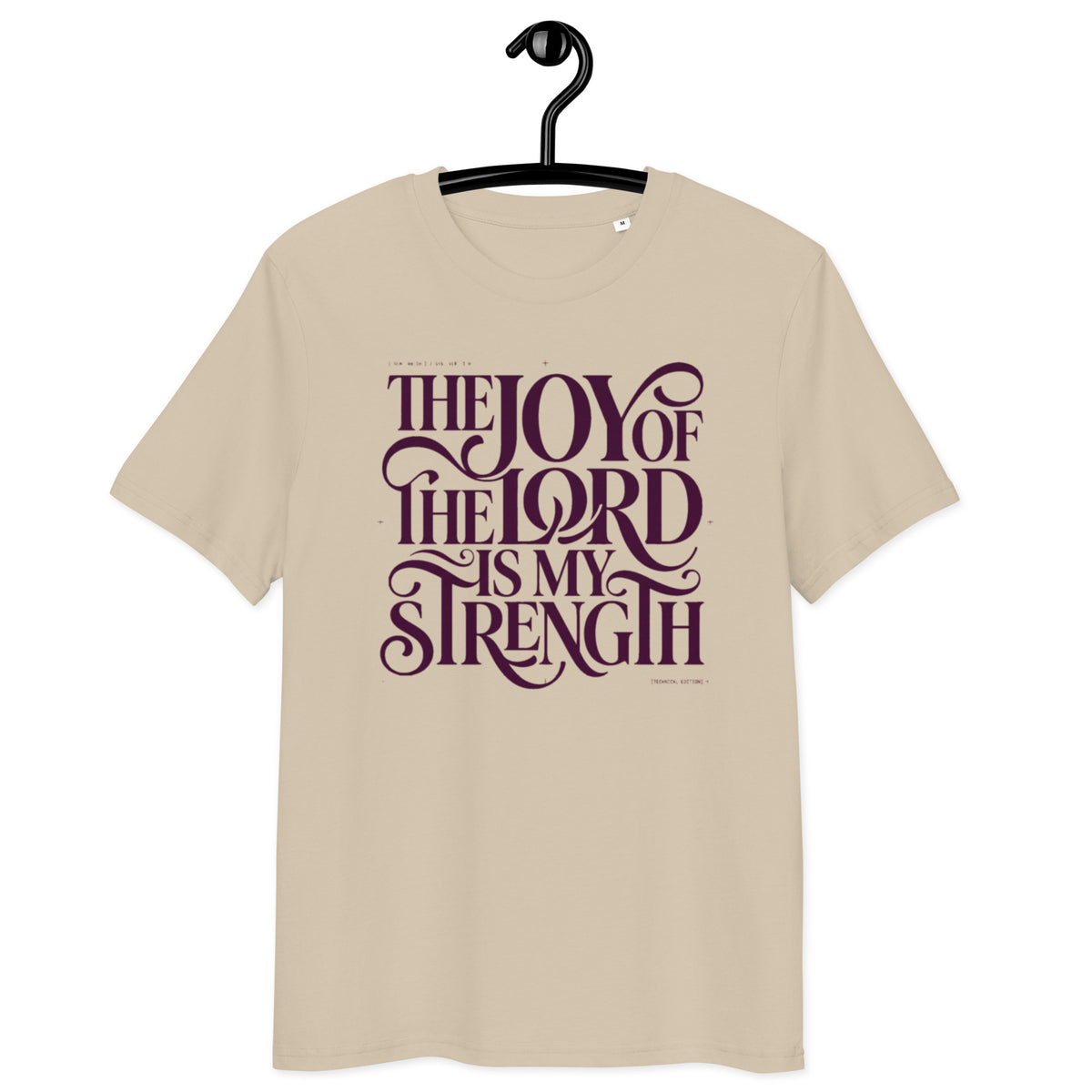 Front view of Desert Dust Joy of the Lord t-shirt on a hanger, with “The Joy of the Lord Is My Strength” in dark flowing lettering
