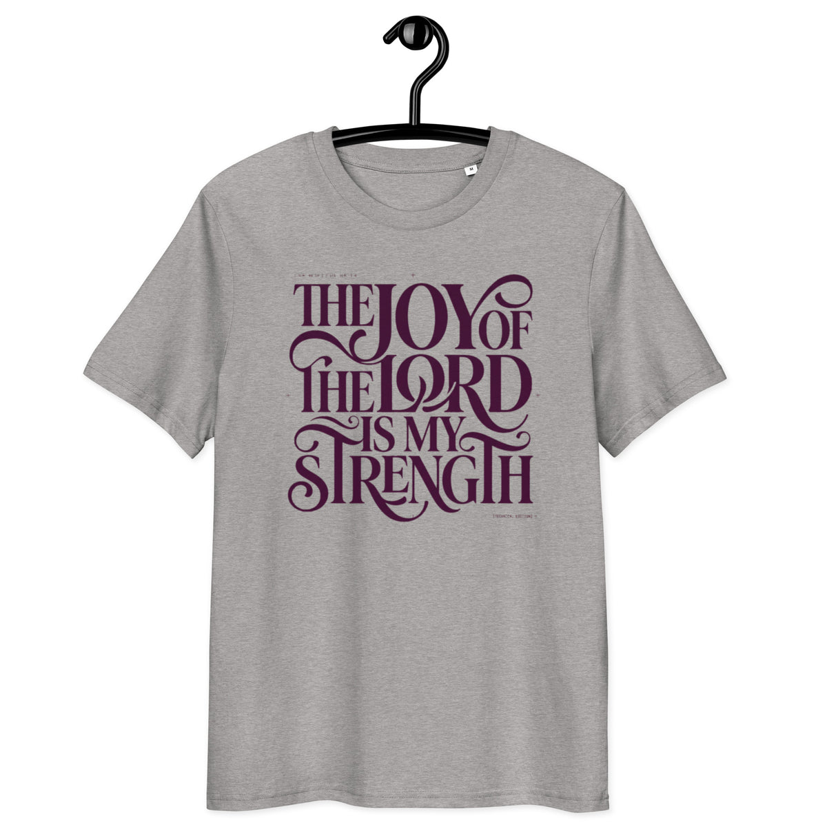 Front view of Heather Grey Joy of the Lord t-shirt on a hanger, with “The Joy of the Lord Is My Strength” in dark flowing lettering.