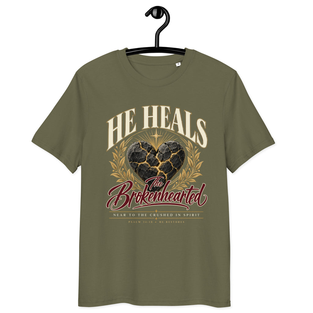 Front view of Khaki He Heals the Brokenhearted t-shirt on a hanger, showing heart artwork and “Near to the crushed in spirit” lettering.