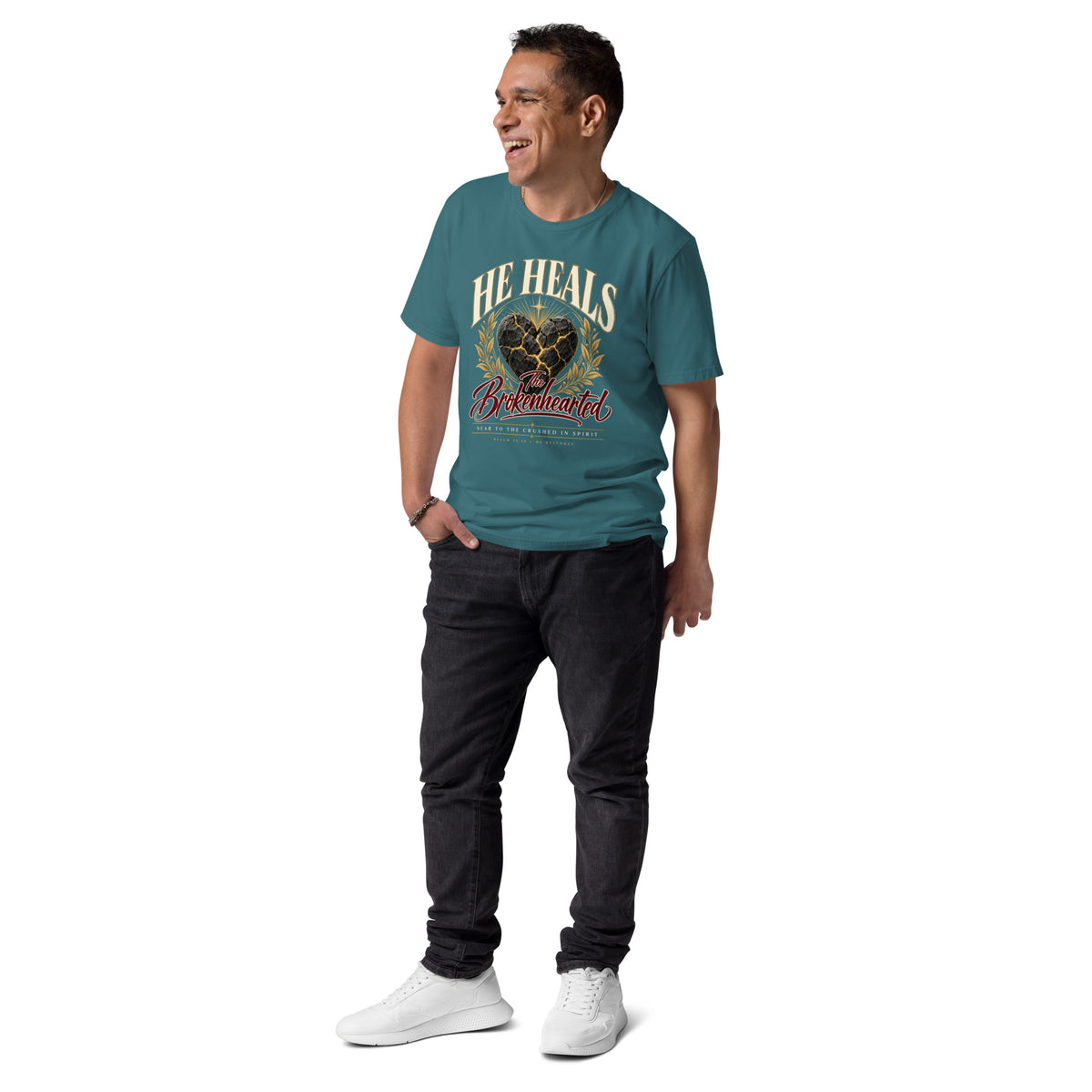 Man wearing a Stargazer He Heals the Brokenhearted organic cotton t-shirt with heart artwork, full-length view.