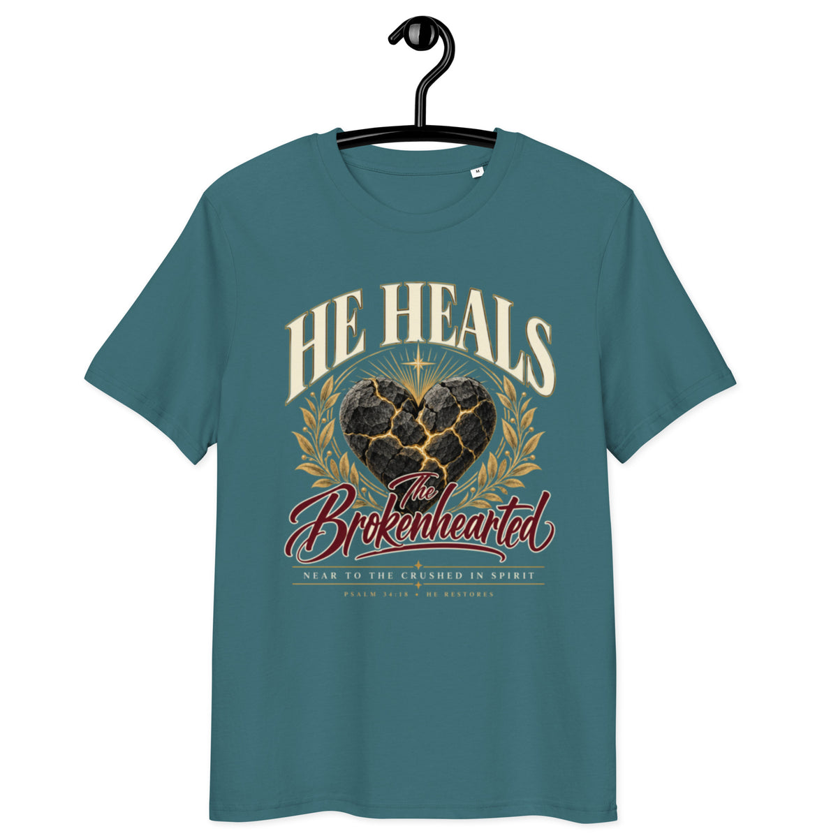 Front view of Stargazer He Heals the Brokenhearted t-shirt on a hanger, showing heart artwork and “Near to the crushed in spirit” lettering.